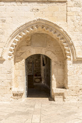 Fototapeta na wymiar narrow streets of old Jerusalem. Stone houses and arches