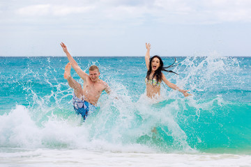 young loving happy  couple on tropical beach