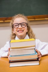 Smiling pupil holding books