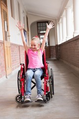 Cute disabled pupil smiling in hall