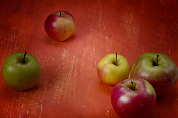 .apples on an orange table