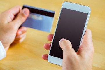 Man using smartphone for online shopping