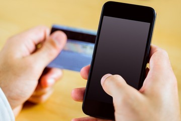 Man using smartphone for online shopping
