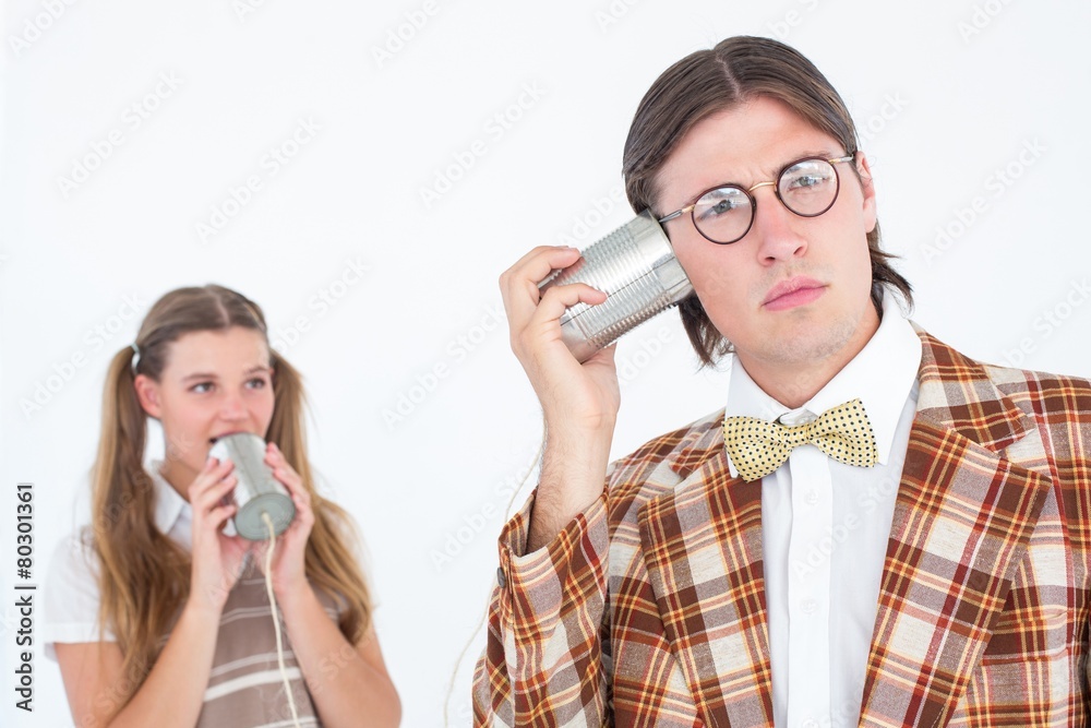 Poster Geeky hipsters using string phone