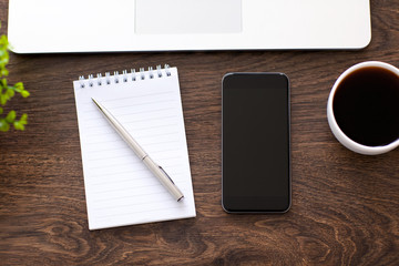 phone lying on a wooden table in the office