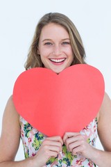 Woman holding heart card