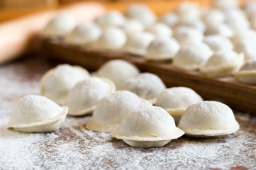 Fototapeta na wymiar Domestic raw dumplings on the table