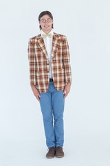 Geeky hipster standing straight with forced smile