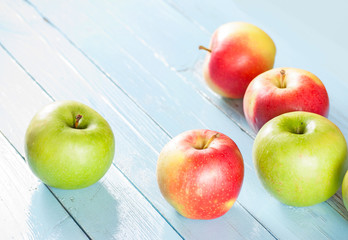 Apples on blue wood background