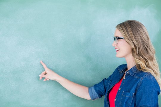 Smiling Geeky Teacher Pointing The Blackboard