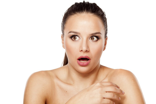 shocked beautiful woman on a white background