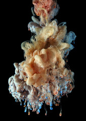 colorful ink color drop on black background