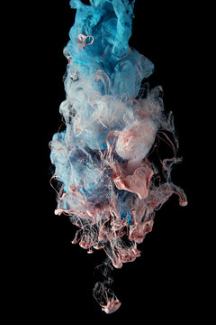 Color drop creating a silk drapery. Ink falling underwater. 