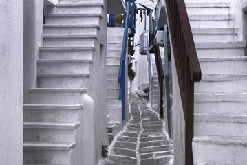 Beautiful whitewashed street in the old town of Mykonos, Greece © Visual Voyager