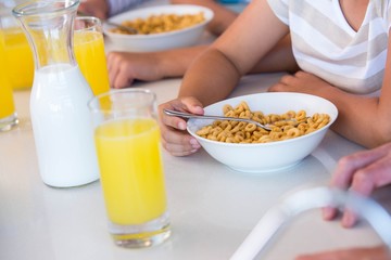 Happy family having breakfast together