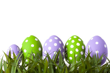 Row of Easter eggs in Fresh Green Grass