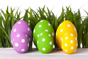 Easter eggs lying on the meadow