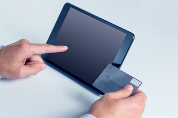 Man using tablet for online shopping