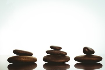 Fototapeta na wymiar Zen stones balancing on white background
