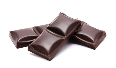 Dark chocolate bars stack with crumbs isolated