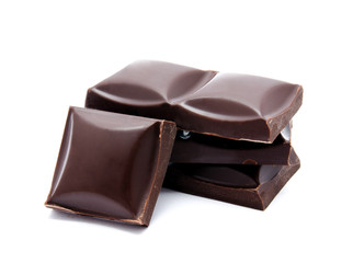 Dark chocolate bars stack with crumbs isolated