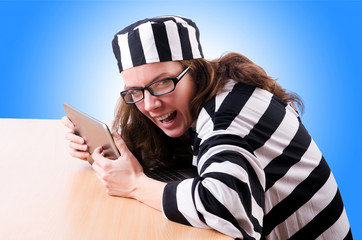 Criminal hacker with laptop on white