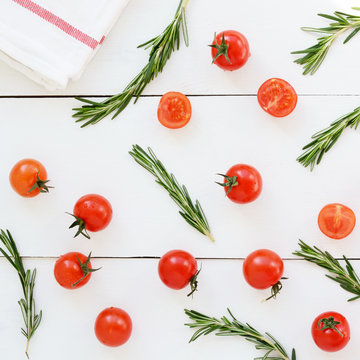 Cherry tomatoes and fresh rosemary on white background, square