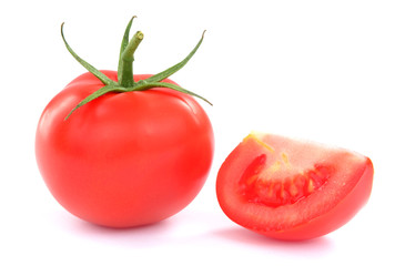 fresh tomatoes with green leaves isolated on white background