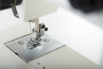 Close look of sewing machine needle