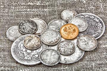 old coins on sacking