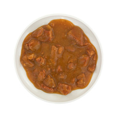 Roast beef in gravy on small plate