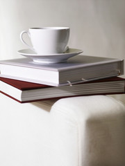 Tea cup on top of Books