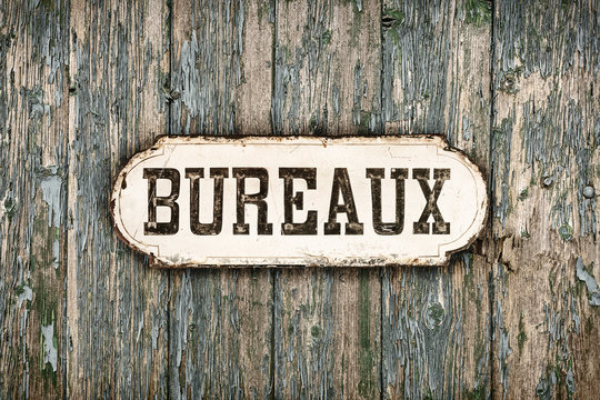 Retro styled image of an old French office sign