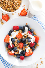 fresh berries, yogurt and muesli for breakfast close-up