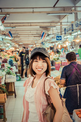 Active Asian tourism is touring in Thailand open market in vinta