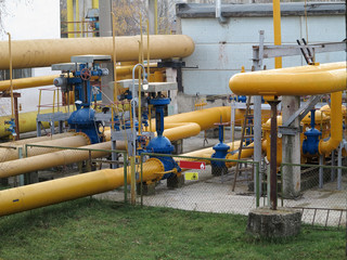 Natural gas station with yellow pipes power plant