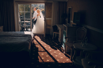 Obraz na płótnie Canvas blonde bride with her groom