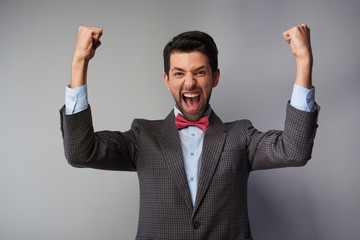 Very happy casual young man wearing tweed jacket