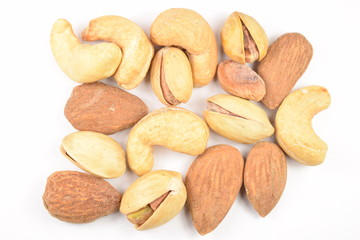Pile of mixed nuts isolated on a white background.