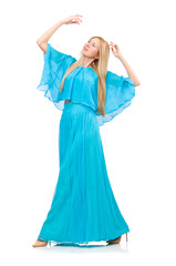 Woman dances in gentle blue dress isolated on white