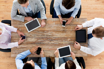 business team with smartphones and tablet pc