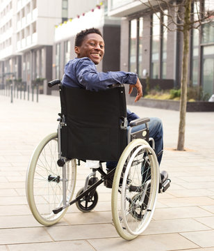 happy young man in a wheelchair