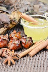 Fototapeta na wymiar Set with star anise fried chestnut honey and cinnamon sticks