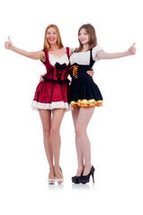 Girls in bavarian costumes isolated on white