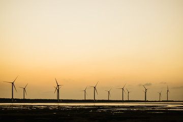 Wind turbines at sunset