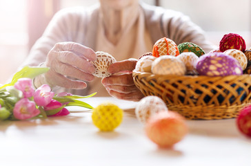 Senior woman with easter eggs