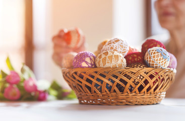 Senior woman with easter eggs