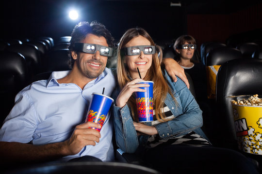 Happy Couple Watching 3D Film In Theater