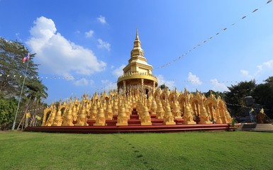 The golden pagodas with sunset sky at Watpa sawangboon