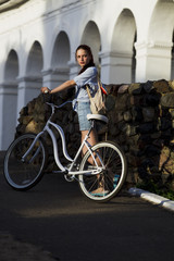 Naklejka na ściany i meble Girl and white bike